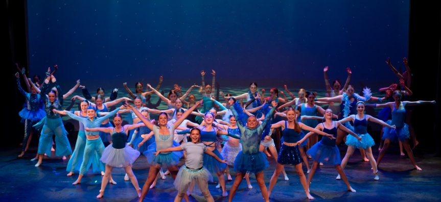 Young dancers celebrate on stage